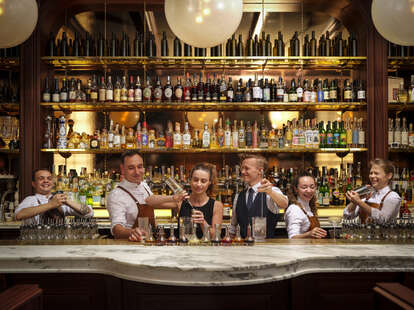 bartenders working behind bar at side hustle