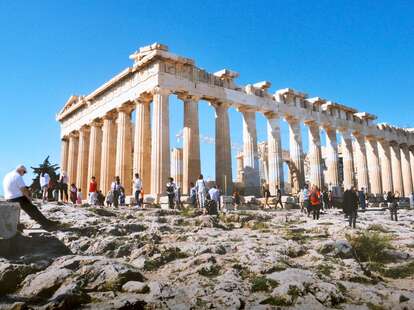 tourists gathering around parthenon in athens, greece