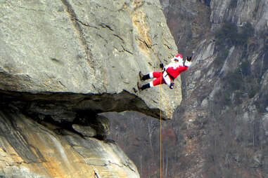 santa claus rappels down chimney rock in north carolina