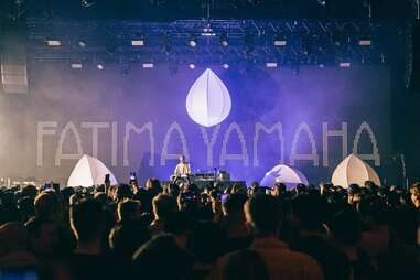 crowd gathering around dj at here at outernet nightclub, london