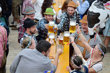 People clink their beer glasses