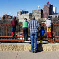 Father standing on Stone Arch bridge in Minneapolis, Minnesota 